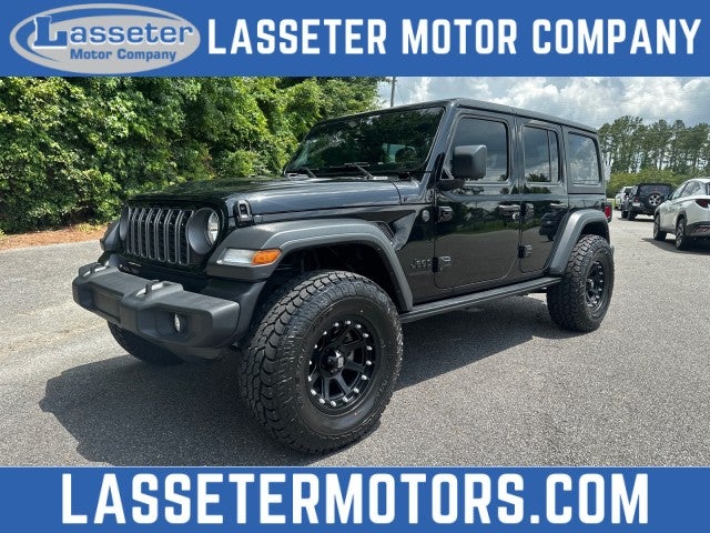 2025 Jeep Wrangler Sport in Black — front three-quarter view